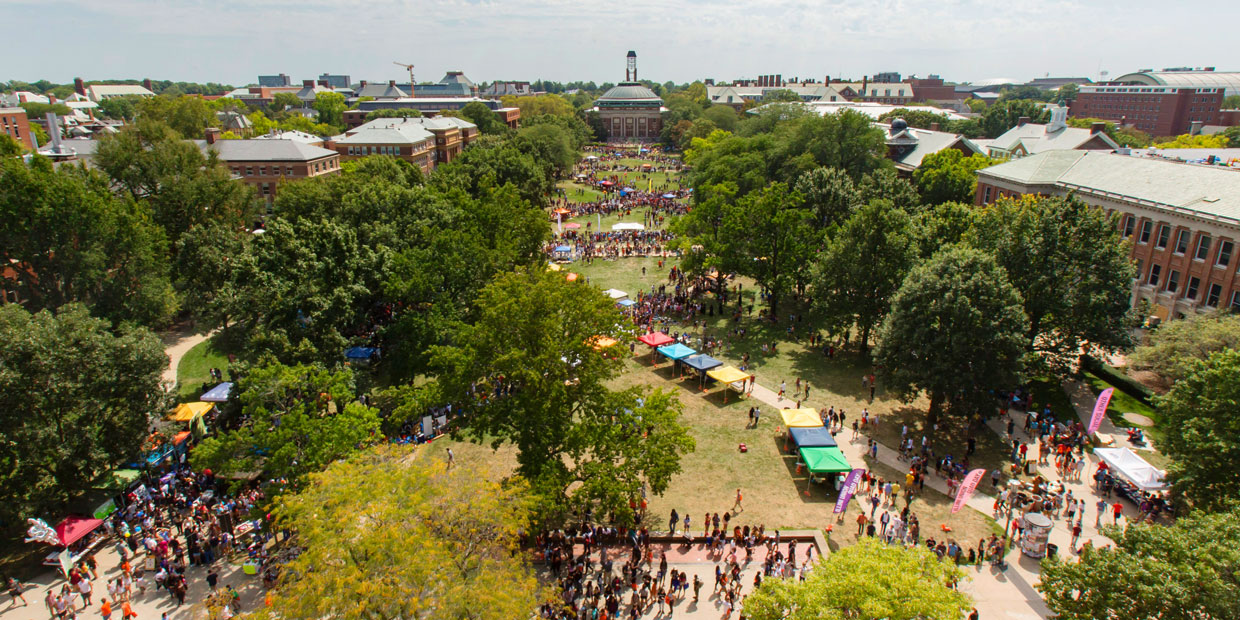 wide-angle shot of the Quad filled with tents and people on Quad Day