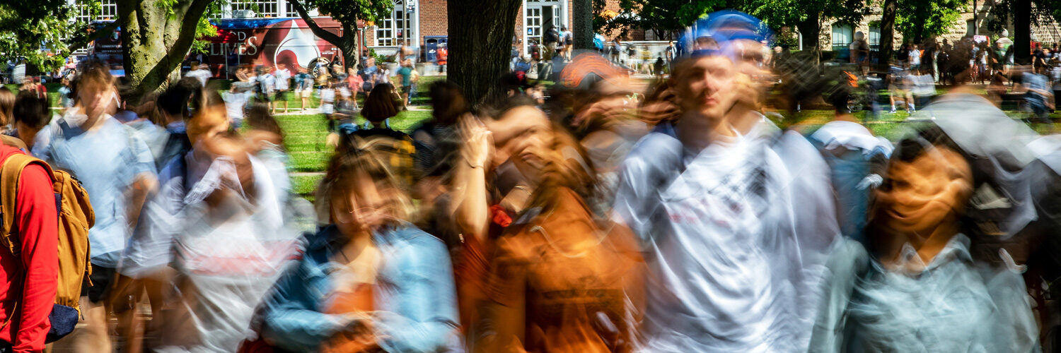long exposure of students in motion on the Quad blurring the action
