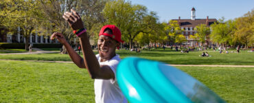students playing frisbee on the Quad