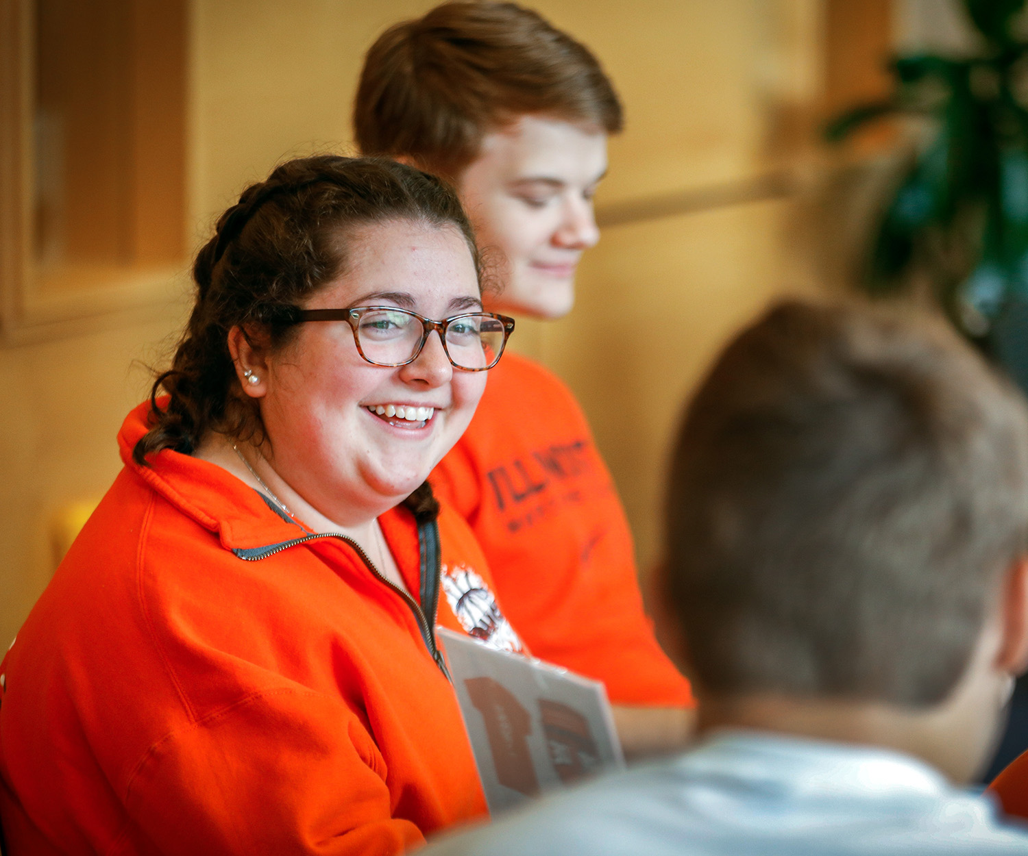 Work-study students helping guide new students in the Ikenberry Dining Hall.
