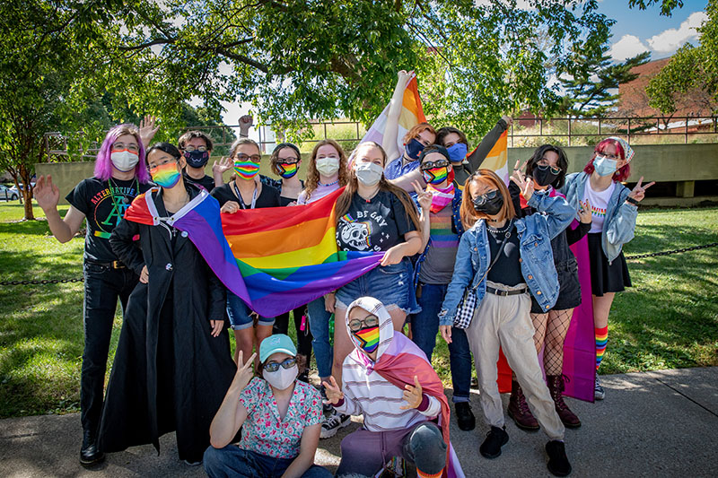 Members of the LGBT Resource Center from the University of Illinois Urbana-Champaign join together as they gather to march in the CU Pride Fest Parade