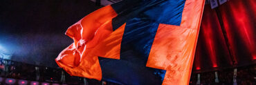 Illini flag being waved on the court of State Farm Center during a men's basketball game
