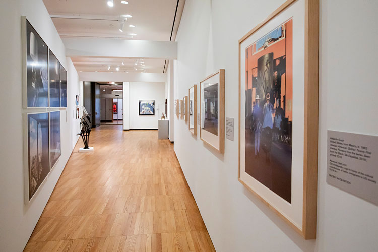 interior view of a hallway full of permanent collection pieces in the Krannert Art Museum
